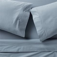 the sheets and pillowcases are made up in two colors, light blue or dark gray