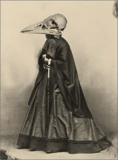 an old photo of a woman with a large bird's head