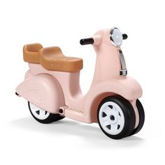 a pink toy scooter with white wheels and brown seat on a white background