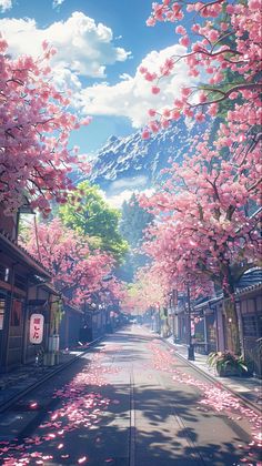 an empty street with pink flowers on the trees