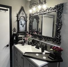 a bathroom sink sitting under a large mirror