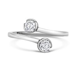 two white gold rings with diamonds on them