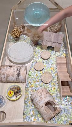 a table topped with lots of different types of crafts and items on top of it