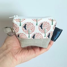 This is a really cute mini zip-up pouch that is the perfect size for you to protect your earpod box. It is also a handy little pouch to keep in your bag for little bits and pieces that you need to be able to find easily, like your keys, lip balm or cash. There is also a key ring and  lobster clasp meaning you can attach it to the inside or outside of your bag to stop it getting lost.  They are all two-tone, made from cotton and lined with cotton. There are seven colour options: 1) Grey backgroun Casual Portable Pouch For Gifts, Portable White Coin Purse For Everyday Use, White Coin Purse For Everyday Use, Casual Pouch With Zipper Closure For Gift, Casual Pouch With Zipper Closure As A Gift, White Coin Purse With Zipper Closure As Gift, Portable White Coin Purse For Gift, Casual Pouch With Cell Phone Pocket As Gift, Casual Zipper Pouch Pencil Case Gift