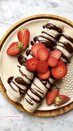 strawberries and ice cream arranged on a plate