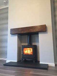 a wood burning stove in the corner of a room