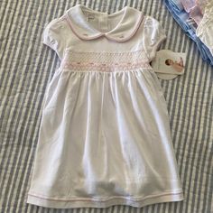 Nwt Magnolia Baby Pima Smocked Dress Sz 18 M. Fully Lined With Diaper Cover. The Sweetest Little Dress. Perfect For Any Occasion. So Soft. White Short Sleeve Smocked Dress For Playtime, White Cotton Smocked Dress With Short Sleeves, White Smocked Dress For Playtime In Spring, White Smocked Dress For Playtime In Summer, Baptism Smocked Dress With Short Sleeves, White Smocked Dress For Summer Playtime, White Smocked Dress For Playtime, Cute White Smocked Dress For Playtime, White Smocked Bodice Dress For Playtime