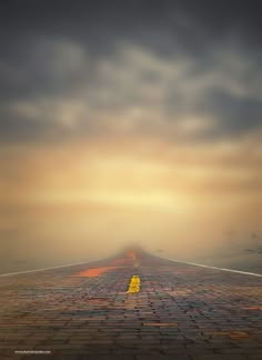 an empty road is shown with the sky in the background