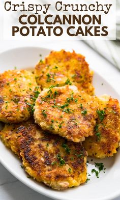 crispy crunchy colcanon potato cakes on a white plate