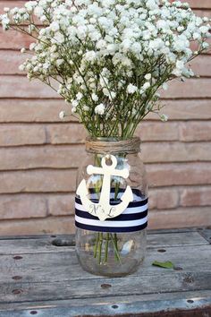 a mason jar filled with baby's breath flowers