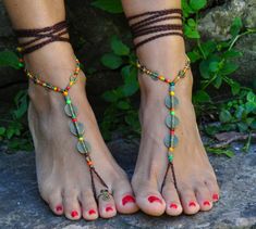 This listing is for a PAIR of barefoot sandals. Beautiful and unique barefoot sandals with a ethnic vibration. They look great as necklace or on the hands too :) Handmade crocheted with love and care using waxed polyester cord, antique bronze spirals and glass beads. The lace is long enough to wrap it 2 times around the leg. Each end of the string is closed with glass beads and brass beads. These resistant sandals are suitable for many environments. You can wear it barefoot on the beach :) They Brown Toe Loop Barefoot Sandals For Beach, Brown Ankle Strap Barefoot Sandals For Festivals, Bohemian Brown Toe Loop Sandals, Handmade Brown Barefoot Sandals With Toe Loop, Handmade Brown Barefoot Sandals With Single Toe Strap, Gold Ankle Wrap Barefoot Sandals For Festival, Handmade Brown Barefoot Sandals For Beach, Adjustable Brown Toe Ring Sandals For Beach, Bohemian Brown Toe Loop Barefoot Sandals