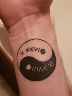 a person's wrist with a tattoo on it that says vix and xxii