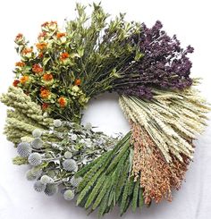 an assortment of dried flowers arranged in a circle