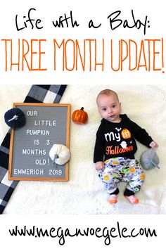 a baby laying on top of a blanket next to a sign that says, life with a baby three month update