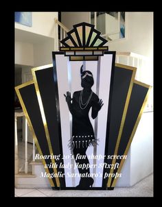 a black and gold art deco sign with an image of a flap dancer on it