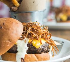 a close up of a hamburger on a plate