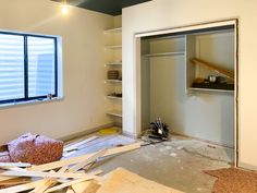 an empty room is being remodeled with tools on the floor and other items scattered around