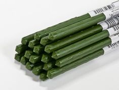 there are several stalks of green vegetables on the white table with text that reads, 3 study stakes - bulk pack of 20