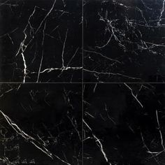 a black marble tile with white lines on it