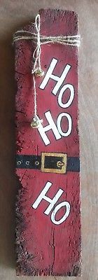 a wooden sign with the word ho ho written on it