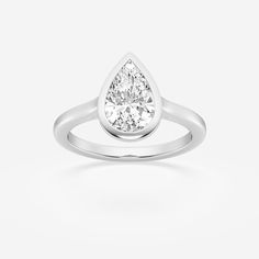 a pear shaped diamond ring on a white background