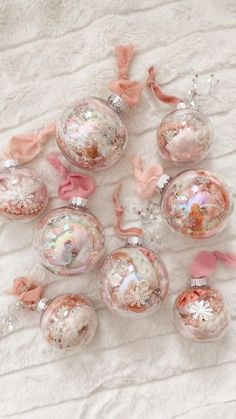 pink and silver ornaments on a white blanket