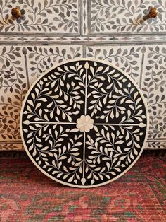 an intricately decorated dresser with drawers and drawers on the bottom, is shown in black and white