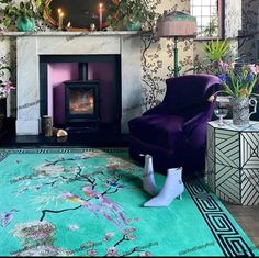 a living room filled with furniture and a fire place