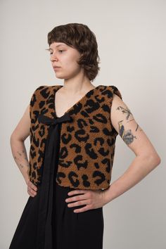 Animal Print Vest by BOSAKA Berlin 🖤 Check out the photos to see the vest, fabric texture, details and packaging up close. Customization is possible - please reach out before buying! DETAILS V-neck vest with tie Double-sided Multicolored: animal print and black Made in Berlin, Germany FREE WORLDWIDE SHIPPING SIZE AND FIT One-size Model is 174 cm and wears size M MATERIAL AND CARE Animal print side: polyester Black side: 100% cotton Machine wash at 30oC, do not tumble dry Do not bleach Animal Print Vests, Cute Vest, Y2k Cute, Vest Outfits, Black Side, Fabric Texture, Womens Vest, Halloween Shopping, Animal Print