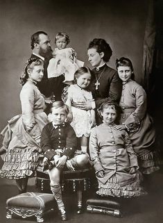 an old black and white photo of a family