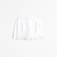 Ultra high rise mini skort in our soft linen-blend fabric, featuring a shorts lining for comfort and side zipper for a secure fit. White Mini Skort, Fitted Linen Mini Skirt For Summer, Fitted Linen Shorts For Spring, Fitted Linen Mini Skort, Fitted Linen Skort For Spring, Linen Skort For Summer, Chic Fitted Linen Mini Skirt, Chic Linen Mini Skirt For Spring, Fitted Linen Summer Skirt