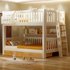 a white bunk bed sitting on top of a hard wood floor