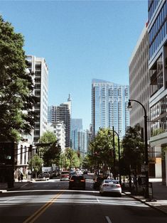 a city street filled with lots of tall buildings