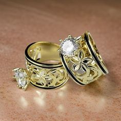 14kt High Quality gold plated Hawaiian Heirloom band ring with CZ stone. This ring is 15mm wide Band with cut out plumeria design on sides and black enamel. Hawaiian Ring, Plumeria Design, Ring Cuts, Heirloom Jewelry, Heirlooms Jewelry, Silver Plated Jewelry, Cz Ring, Favorite Rings, Wide Bands