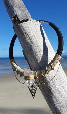 《 Shipibo Quartz Priestess Choker 》 Unique bold handcrafted choker.   Created on a flexible silver plated choker necklace by AlchemEyez. This piece sings of cleansing in the shamanic feminine with a white witch feel. Wrapped with black to cream/beige cotton cord and a strong faux cream cord finish.  Highlighting a large gorgeous and very clear hand picked Quartz crystal point.  Draped with a dainty silver chain and standout silver shipibo pendant.  This is a strong and large choker, a really stu One Of A Kind Adjustable Choker Necklace, One-of-a-kind Adjustable Choker Necklace, Adjustable Wire Wrapped Bohemian Choker, Adjustable Bohemian Wire Wrapped Choker, Bohemian Adjustable Wire Wrapped Choker, Bohemian Wire Wrapped Choker For Festivals, Adjustable Crystal Choker For Festivals, Nickel Free Choker Necklace For Festivals, Handmade Spiritual Choker For Festivals