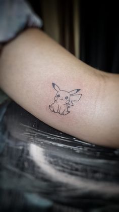 Pikachu Tatto Pikachu Tatoos, Pikachu Small Tattoo, Small Matching Pokemon Tattoos, Simple Pokemon Tattoo Ideas, Pokemon Tattoo Pikachu, Simple Pokémon Tattoo, Pikachu Tattoo Ideas, Fine Line Pokemon Tattoo, Matching Gaming Tattoos