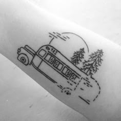 a black and white photo of a bus with trees on it's side arm