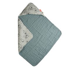 a gray and white baby blanket with animals on it's side, laying down