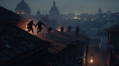 silhouettes of people walking on rooftops in the city at night with buildings lit up behind them