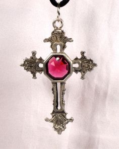 "This is a beautiful hand crafted genuine pewter cross necklace. The center of the cross is a genuine red colored faceted Swarovski crystal. The necklace comes on a black cord.The cross is approximately 2 3/4\" long and 1 3/4\" wide. The cross comes packaged in a gift box." Gothic Crucifix Cross Necklace As Gift, Gothic Crucifix Cross Necklace For Gift, Red Crucifix Cross Necklace Gift, Red Cross Pendant Necklace For Gift, Red Cross Pendant Necklace Gift, Red Crucifix Cross Necklace For Gift, Vintage Red Cross Jewelry, New Rochelle, Purple Roses