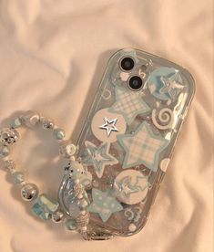 a cell phone case that has some decorations on it