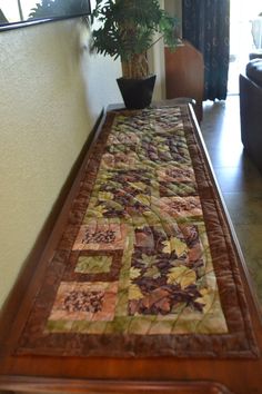 a wooden table with a potted plant on it