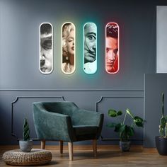 a room with three different colored lights on the wall and a chair in front of it