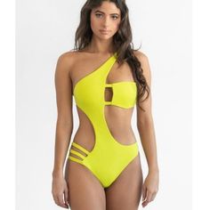 Make a fashion statement in the sexiest one piece swimsuit of the season! Women's citrus yellow swimsuit is asymmetrical, has a structured keyhole with boning bandeau top with side strap detail, and cheeky bottom. Fully lined. Under bust band hook and removable bra cups. Made of Nylon and Spandex. Model is wearing Size Small. Model is 5’8” 32C cup Waist 25” Hips 35.5” Yellow Swimsuit, Busted Band, Yellow Swimsuits, Bandeau One Piece Swimsuit, Bandeau Top, Bra Cups, Neon Yellow, One Piece Swimsuit, Fashion Statement