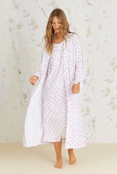 This soft cotton modal ballet wrap robe is designed with a sweet pink rose print. Delicate lace trims the neck band. It is finished with angled ruffle cuffs, a set-in belt and two in-seam pockets. Why we love the Long Wrap Robe: Pockets for all! Soft, feminine fabric Fabric: 44% Modal 43% Cotton 13% Poly Care: Machine wash cold with like colors, gentle cycle, non-chlorine bleach when needed; tumble dry low, remove promptly, low iron if needed. Spring Lace Trim Robe For Bedtime, Spring Bedtime Robe With Lace Trim, Feminine Spring Robe For Bedtime, Feminine Fitted Robe For Daywear, Fitted Feminine Robe For Daywear, Feminine Fitted Daywear Robe, Fitted Feminine Daywear Robe, Elegant Spring Robe For Sleepover, Pink Lace Trim Robe For Loungewear