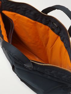 When you use a Porter-Yoshida & Co bag, you can really feel its commitment to making really great accessories. Made from durable and lightweight nylon, this 'Tanker Short Helmet' tote is spacious enough to use as a gym or overnight carryall. It's lined with the signature bright-orange shell. Tote Bag For Men, Cos Bags, Porter Bag, Nylon Tote Bag, Porter Yoshida, Diaper Bag Tote, Latest Bags, Nylon Tote Bags, A Gym