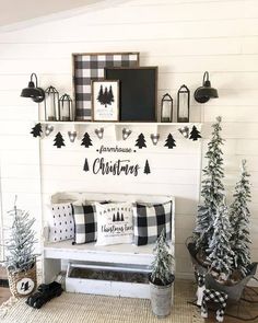 a room with christmas trees and decorations on the wall