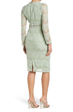 Chic lace constructs this adorable long sleeves dress, a perfect pick for your next soiree. 42" length (size S) Crewneck Long lace sleeves Sheer lattice waist panel Lined Self/lining: 100% polyester Machine wash Imported Model's stats for sizing: - Height: 5'9" - Bust: 34" - Waist: 23" - Hips: 35" Model is wearing size S. Feminine Long Sleeve Lace Midi Dress, Long Sleeve Midi Dress With Lace Patchwork For Party, Fitted Long Sleeve Midi Dress With Lace Patchwork, Formal Long Sleeve Midi Dress With Lace Trim, Elegant Green Dress With Lace Patchwork, Spring Long Sleeve Lace Midi Dress, Feminine Long Sleeve Midi Dress With Lace Patchwork, Spring Lace Midi Dress With Long Sleeves, Long Sleeve Midi Dress With Lace Patchwork For Fall