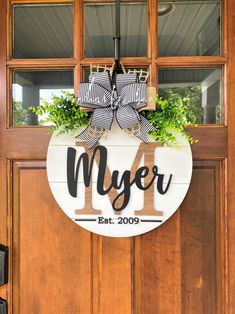 a door hanger that says, i love myer with a bow on it