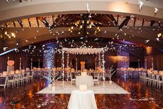 the reception room is decorated with white and silver decorations